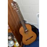 A MANUEL RODRIGUEZ E HIJOS CLASSICAL GUITAR WITH STAND AND CASE, model no C1M 3049, label to