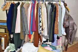 A QUANTITY OF LADIES CLOTHES AND TABLE LINEN AND BEDDING ETC, to include coats, jackets, blouses and