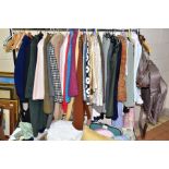 A QUANTITY OF LADIES CLOTHES AND TABLE LINEN AND BEDDING ETC, to include coats, jackets, blouses and