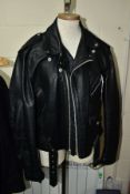 A LEATHER PERFECTO JACKET BY SCHOTT, NEW YORK, size 44, with quilted lining, zip and faux belt