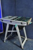 A WOLFCRAFT MASTER CUT precision saw table/workstation along with 3 other stands/workstations (PAT