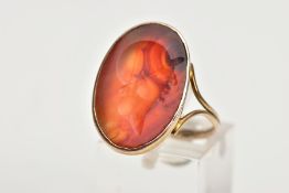 A ROMAN CARNELAIN CAMEO RING, the oval carnelian panel carved with a soldiers head, within a