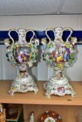 A PAIR OF LATE 19TH CENTURY CONTINENTAL PORCELAIN TWIN HANDLED URN WITH SEPERATE PLINTHS, the S