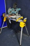 A ERBAUER 10in SLIDING COMPOUND SAW WITH LASER on a DeWALT DE7033-XJ short beam leg stand (PAT