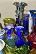 A QUANTITY OF COLOURED DECORATIVE GLASS, to include a Dartington cranberry vase with wavy rim,