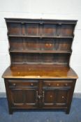 AN ERCOL COLONIAL DRESSER, with two drawers, width 124cm x depth 46cm x height 166cm