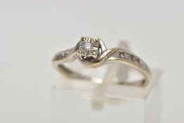 A 9CT WHITE GOLD DIAMOND RING, the ring head of a square form with an illusion set round brilliant