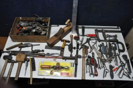 A COLLECTION OF VINTAGE TOOLS to include a number of hammers, spanners, clamps, manual