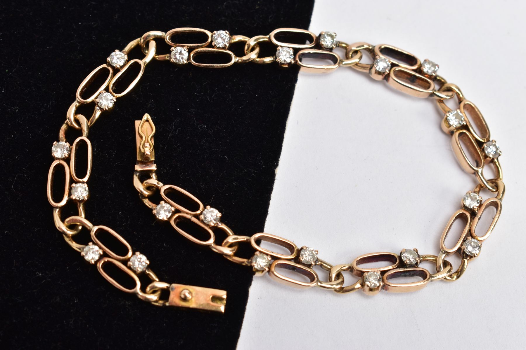 A YELLOW METAL DIAMOND LINE BRACELET, designed with double oval openwork links, each link set with - Image 2 of 3
