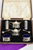 A GEORGE V SILVER FIVE PIECE CONDIMENT SET, to include two pepperettes, two mustards and two salts