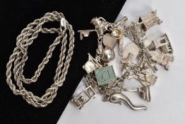 A CHARM BRACELET AND ROPE CHAIN, white metal chiselled chain bracelet fitted with twenty-seven