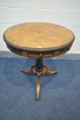 A REGENCY WALNUT DRUM TABLE, the spinning top with a central inlaid star pattern and carving to