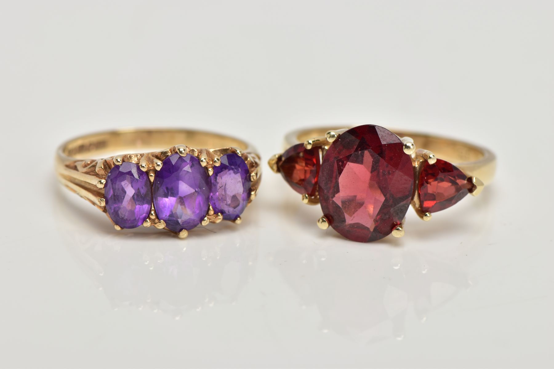 TWO 9CT GOLD GEM SET RINGS, the first designed with a central four claw set, oval cut garnet, - Image 2 of 3