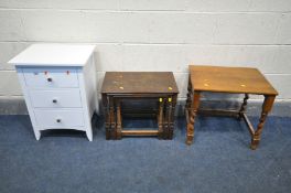 A WHITE THREE DRAWER BEDSIDE CHEST, along with an oak nest of three tables and a barley twist