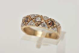 A 9CT GOLD DIAMOND DRESS RING, of a half eternity design, set with three brown round brilliant cut