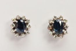 A PAIR OF SAPPHIRE AND DIAMOND CLUSTER EARRINGS, oval cut sapphires assessed as synthetic, set