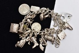 A SILVER CHARM BRACELET, each curb link stamped with a sterling mark, fitted with twenty-three