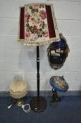 A TIFFANY STYLE FIGURAL STANDARD LAMP (condition:-broken at arm, see image) along with an ornate