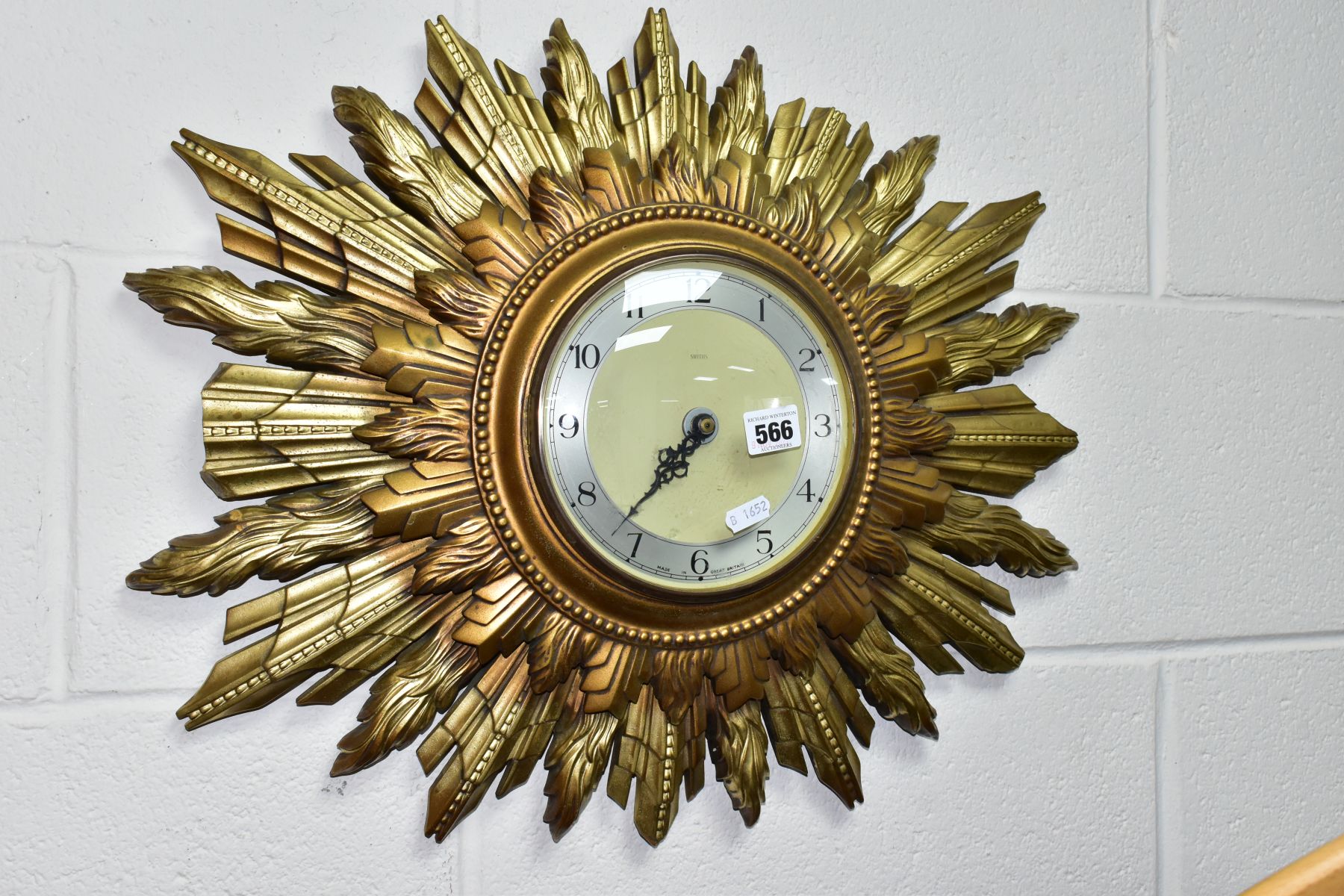 A SMITHS SUNBURST WALL CLOCK, with double sunburst and silvered dial, battery operated, not