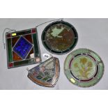 FOUR PIECES OF LEADED AND STAINED GLASS, comprising a shield shaped section decorated with