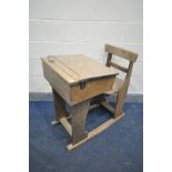 AN EARLY 20TH CENTURY OAK SCHOOL DESK AND SEAT