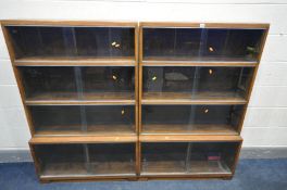 TWO 'MINTY' OAK FOUR TIER SECTIONAL BOOKCASES, with sliding glazed doors, width 89cm x depth 29cm