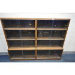 TWO 'MINTY' OAK FOUR TIER SECTIONAL BOOKCASES, with sliding glazed doors, width 89cm x depth 29cm