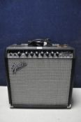 A FENDER CHAMPION 40 with, two channel amplifier with power cable (PAT pass and powers up but