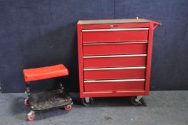 A RED FIVE DRAW ROLLING CABINET/TOOL CHEST containing a Sealy Torque Wrench, Ratchets,a number of