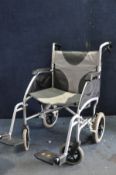 A DRIVE ENIGMA lightweight folding wheelchair with footrests