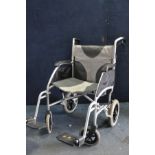 A DRIVE ENIGMA lightweight folding wheelchair with footrests