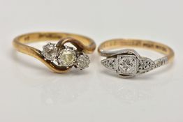 TWO YELLOW METAL DIAMOND RINGS, the first a three stone ring designed with a central round brilliant