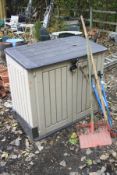 A PLASTIC OUTDOOR STORAGE UNIT, with double doors and a hinge top, width 127cm x depth 72cm x