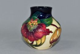 A SMALL MOORCROFT VASE, Anna Lily pattern, impressed and painted backstamp and JLS with painted