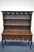 A REPRODUDUCTION GEORGIAN STYLE DRESSER, with double plate rack back with six small drawers, over