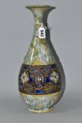 A ROYAL DOULTON STONEWARE VASE BY LOUISA WAKELY, of baluster form with flared neck, raised and