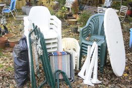 A WHITE OVAL PLASTIC GARDEN TABLE,136cm x 90cm and a set of six white and set of five green