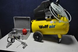 A WOLF AIR 50ltr air compressor (PAT pass and working) along with a metal case containing spray guns