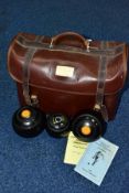 A BROWN LEATHERETTE CROWN GREEN BOWLING CARRY CASE, containing a Henselite N95 BCG BA jack, a pair
