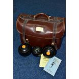 A BROWN LEATHERETTE CROWN GREEN BOWLING CARRY CASE, containing a Henselite N95 BCG BA jack, a pair