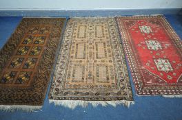 FIVE VARIOUS RUGS OF VARIOUS STYLES AND AGES, include Tekke green ground rug, Serab rug, etc,