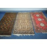 FIVE VARIOUS RUGS OF VARIOUS STYLES AND AGES, include Tekke green ground rug, Serab rug, etc,