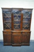 A REPRODUCTION MAHOGANY TRIPLE DOOR BREAKFRONT BOOKCASE, over three drawer and three cupboard doors,