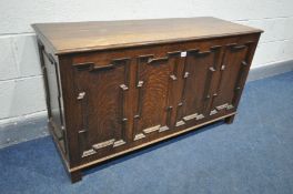 AN OAK GEOMETRIC PANELLED COFFER, width 120cm x depth 43cm x height 67cm (condition:-fluid marks)