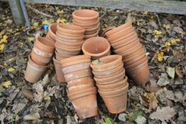 A LARGE QUANTITY OF SMALL TERRACOTA PLANT POTS (40+)