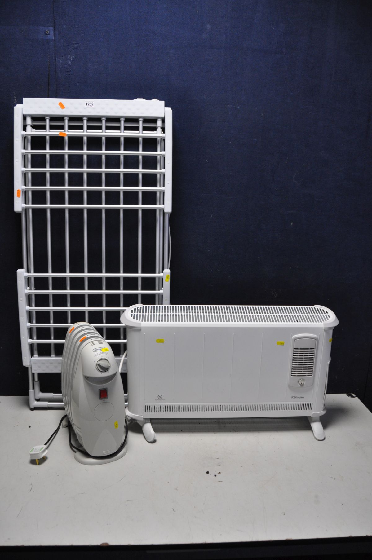 A DIMPLEX 403TSFTie DIGITAL RADIATOR AND BLOW HEATER, a smaller De'Longhi Bambino floor heater,