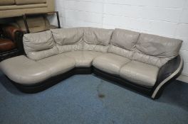A BLACK AND PALE GREY ROUNDED CORNER SOFA, breaks into two sections, length 260cm x depth 207cm (