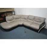 A BLACK AND PALE GREY ROUNDED CORNER SOFA, breaks into two sections, length 260cm x depth 207cm (