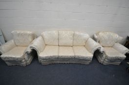 A CREAM FLORAL UPHOLSTERED THREE PIECE SUITE, comprising a three seater sofa, length 215cm, and a