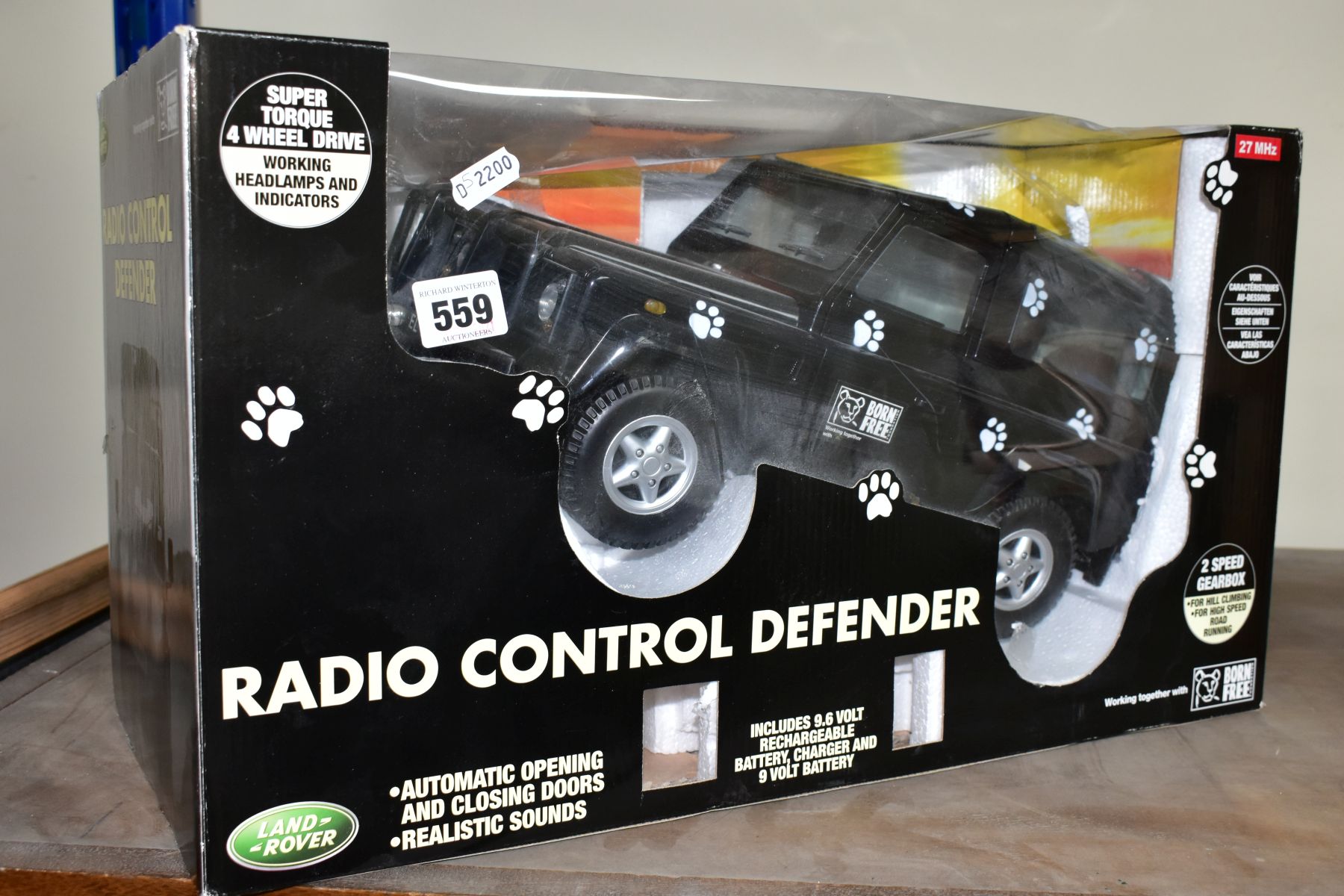 A BOXED RADIO CONTROLLED LAND ROVER DEFENDER, black Born Free edition, in original packaging with - Image 2 of 4